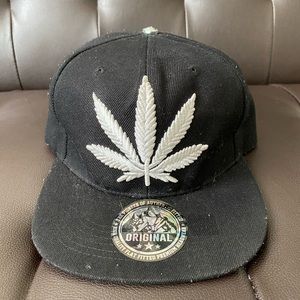 Pot leaf snapback with white embroidered leaf on front and back